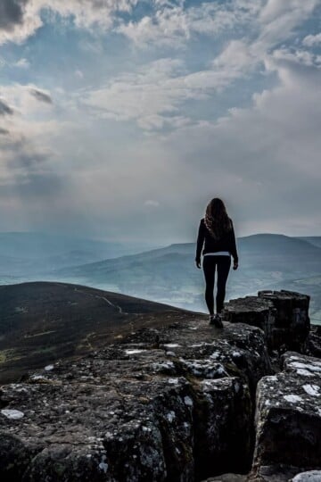 Beck stands on top of Sugar Loaf Mountain in Monmouthshire Wales