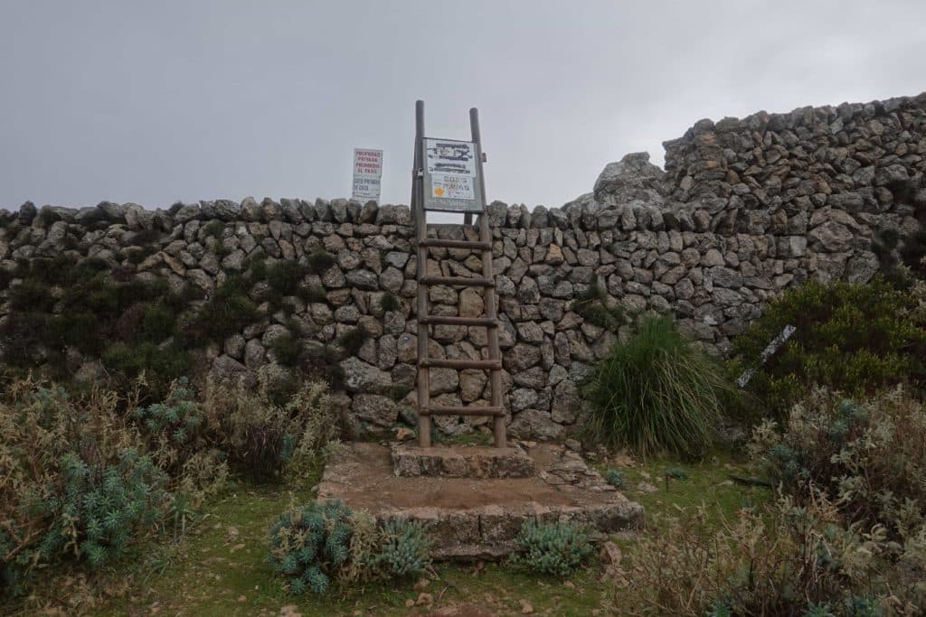 A partially blocked ladder leading to Puig Des Teix