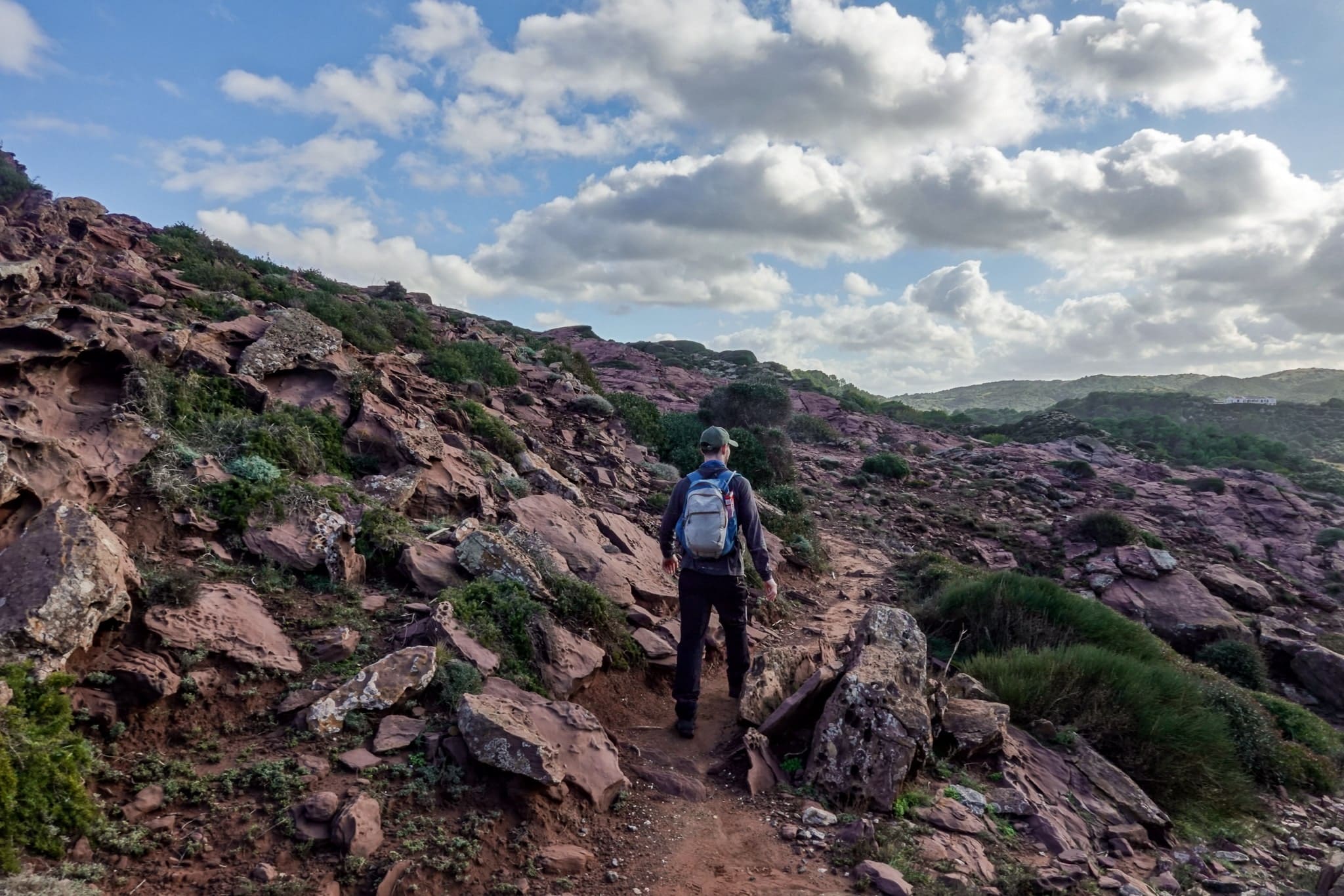 Dan hiking on the Menorcan coastline near Cala Calderer