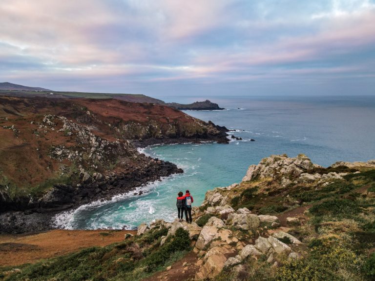 Dan and Beck at Pendour Cove from Zennor Head, on Zennor to St Ives Walk – one of the best hikes in Cornwall