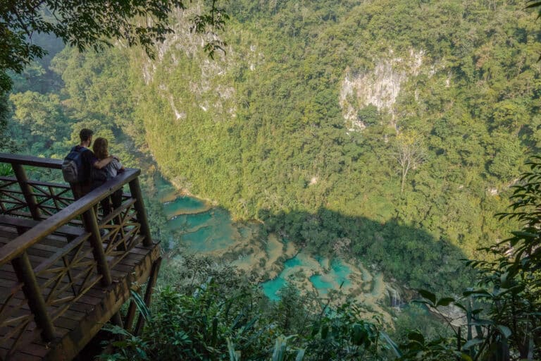 Dan and Beck stand in the corner of the large platform overlooking the magnificent Semuc Champey pools