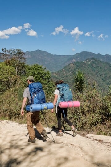 Dan and Beck backpacking with travel accessories stored away