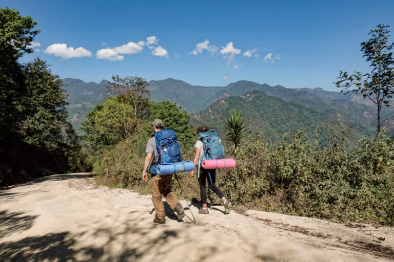 Dan and Beck backpacking with travel accessories stored away