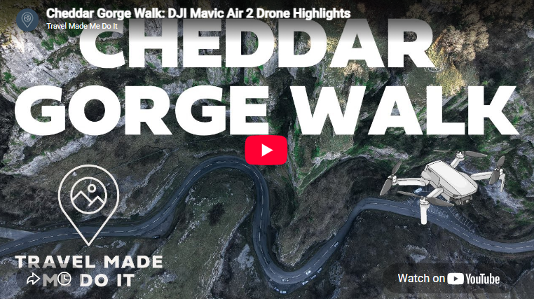 A birds-eye view of a winding road within a gorge called Cheddar Gorge