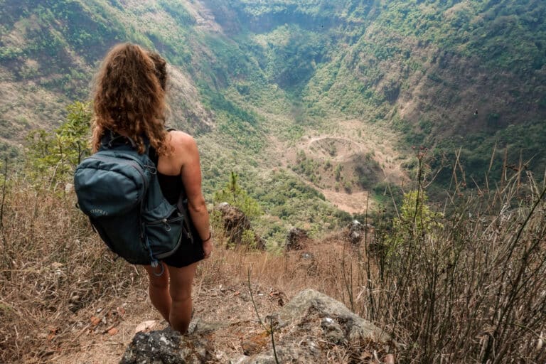 Beck admires two craters during the San Salvador Volcano hike in El Boquerón National Park