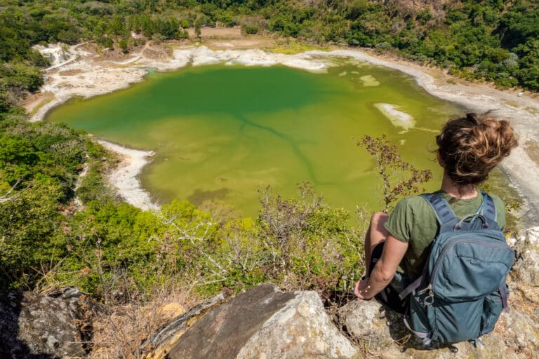 Beck sits and admires Laguna de Alegria during the hike up Volcan Tecapa