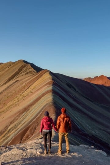 Dan and Beck stand at Rainbow Mountain in Peru