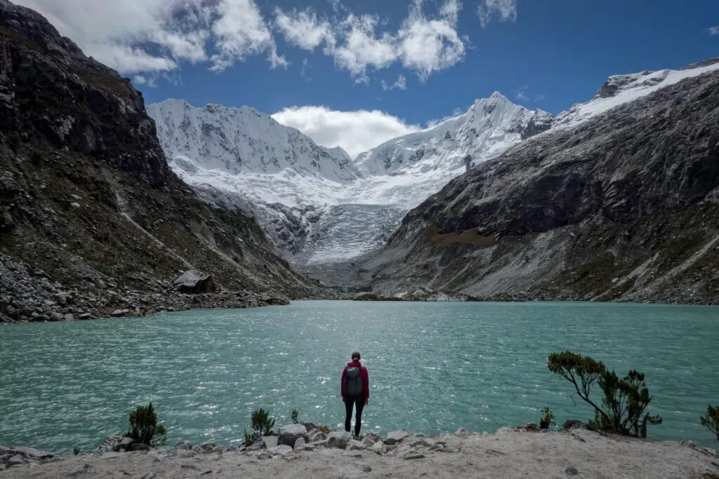Beck looks at Laguna Llaca, and the Ranrapalca and Ocshapalca mountains, near Huaraz