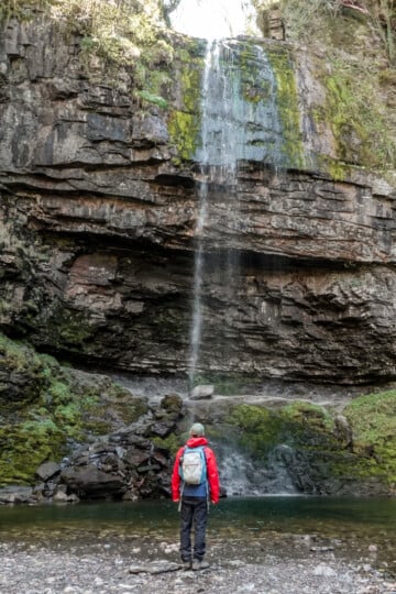Dan stands at Henrhyd Falls the Batman Cave