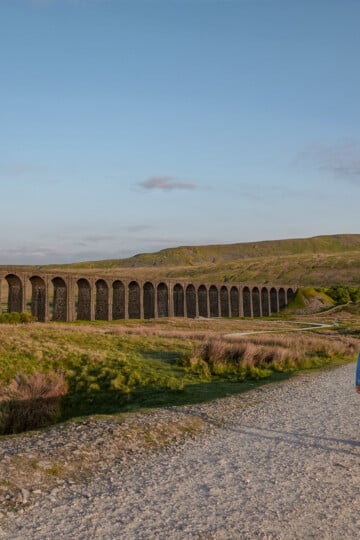 Dan walks towards Ribblehead Viaduct and Whernside in the Yorkshire Dales