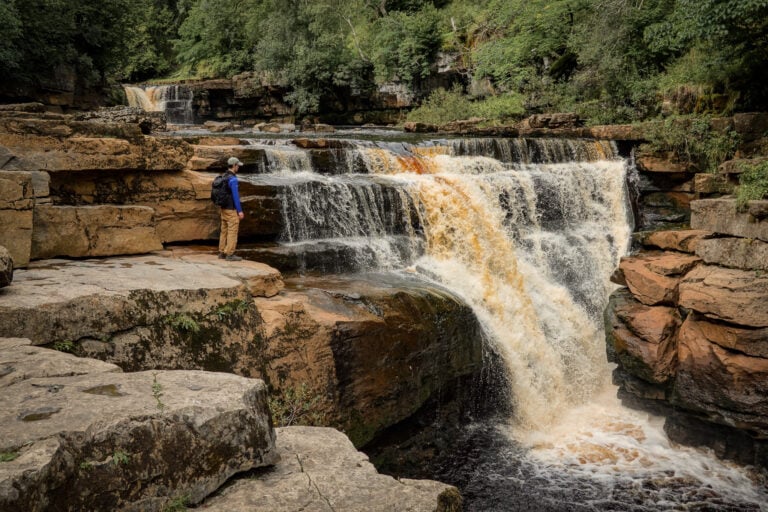Dan at Kisdon Force, one of the best waterfalls in the Yorkshire Dales for wild swimming