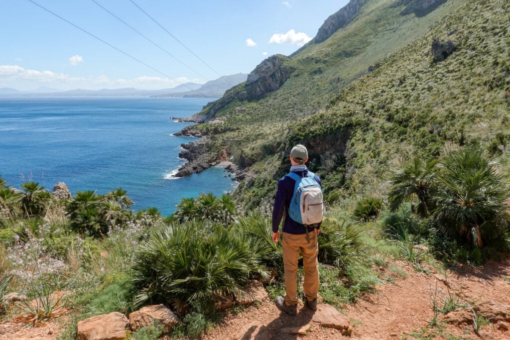 Dan stops to admire the views of the sea on the coastal trail in the Zingaro Nature Reserve in Sicily