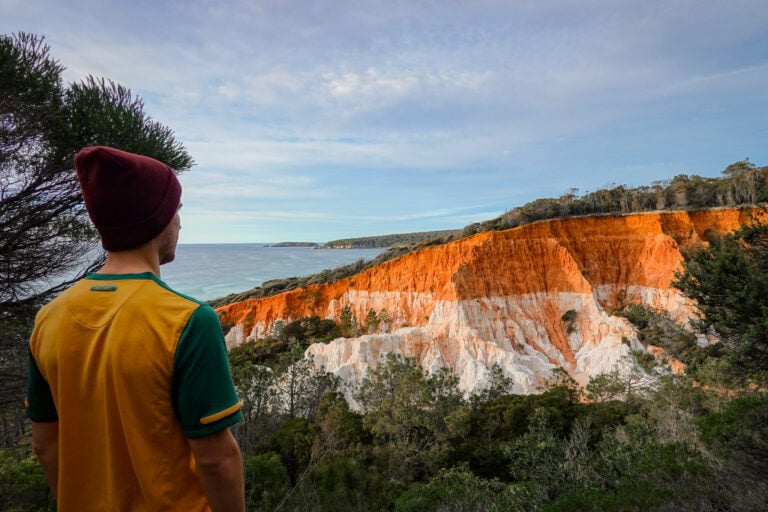 Dan looks at a rock formation called The Pinncales during a road trip on the Sapphire Coast of NSW