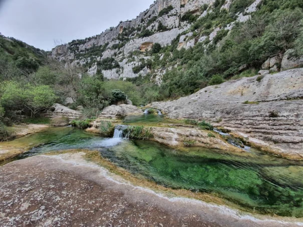 A lake wiht a small cascade