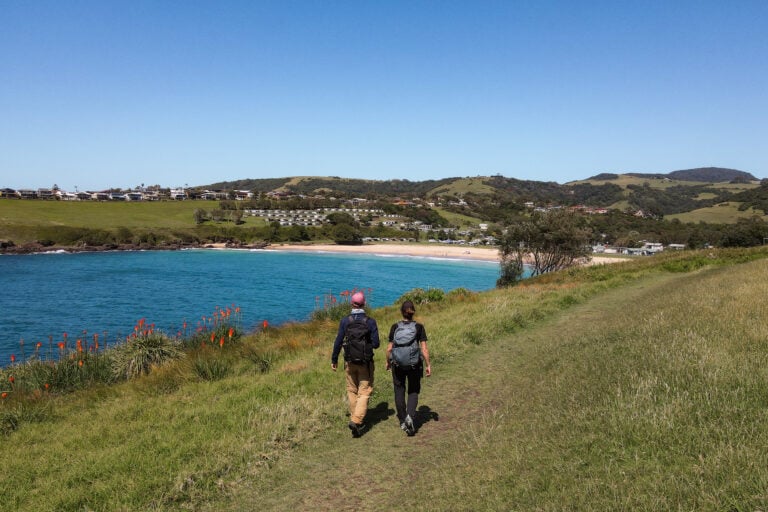 Dan and Beck on the Kiama Coastal Walk approaching a beach called Easts Beach