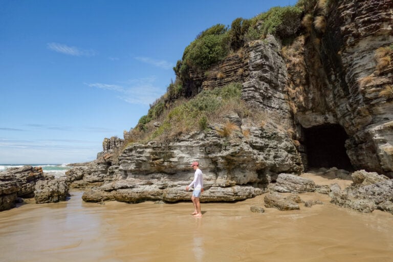 Man walks along Cave Beach Jervis Bay