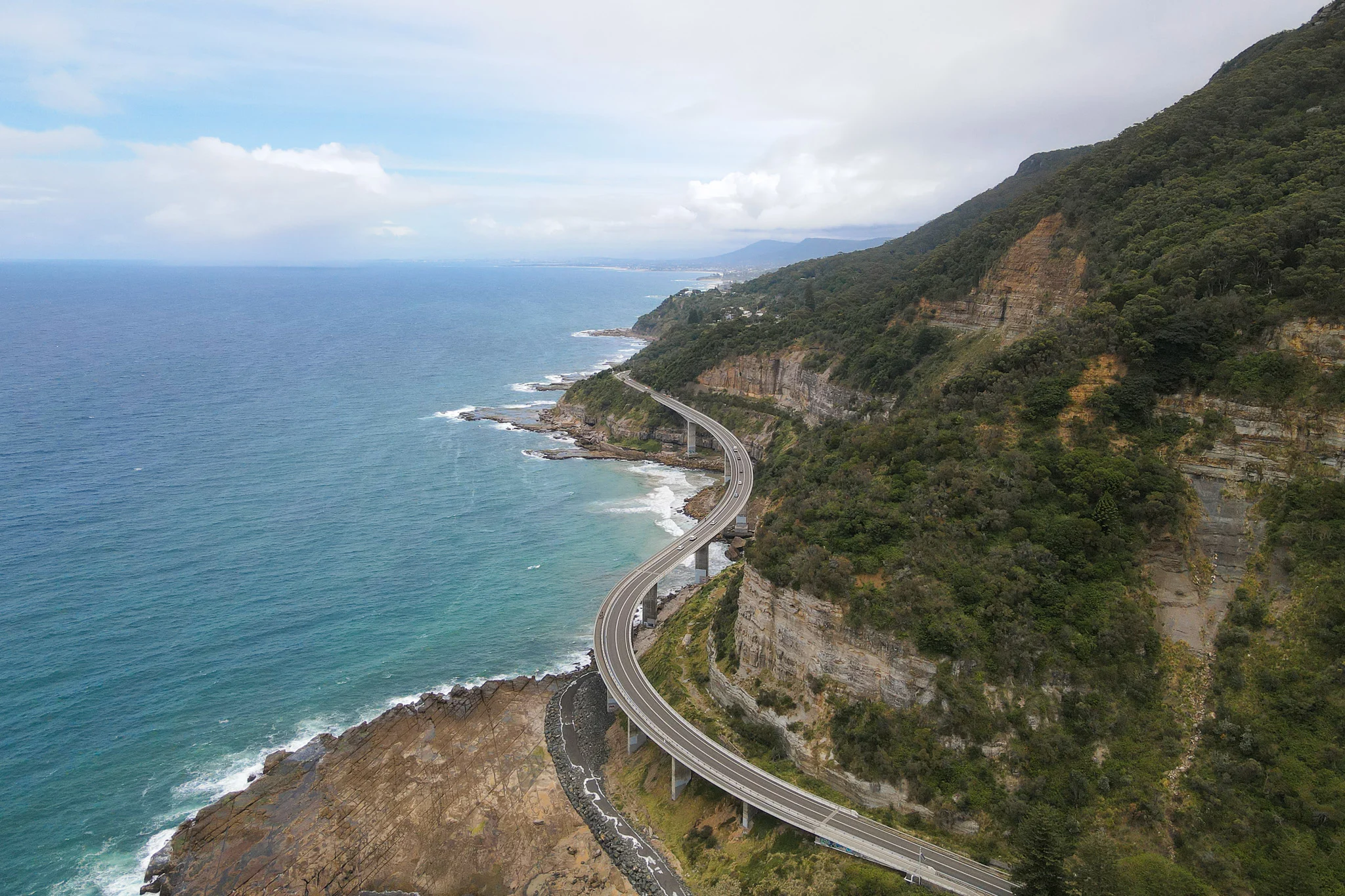 A curved road over the ocean called the Sea Cliff Bridge in Wollongong