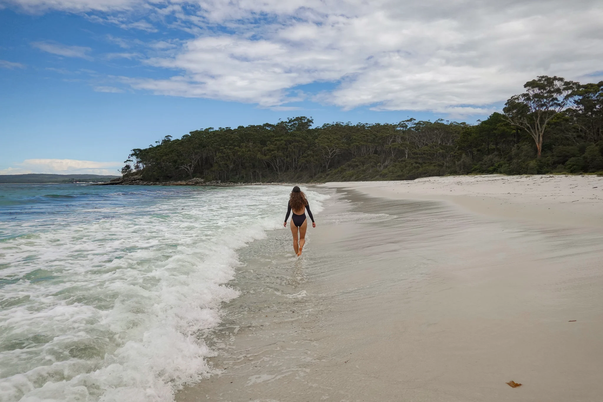 Beck walks along Greenfield Beach in Jervis Bay, Shoalhaven