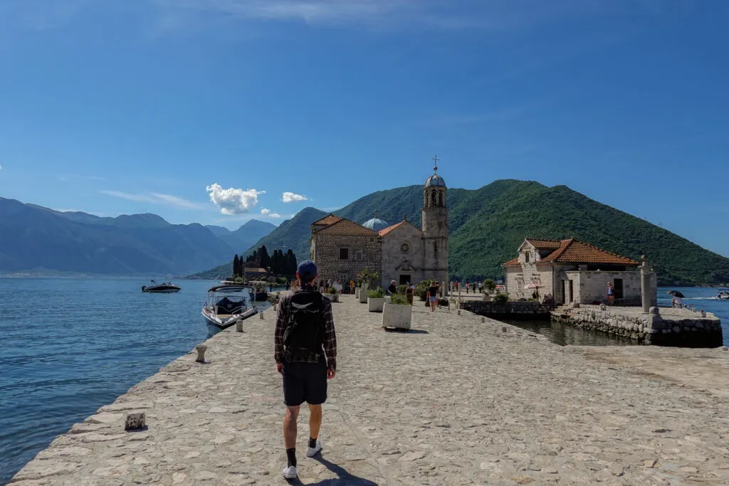 Walking on the man made islet of Our Lady of the Rocks in Montenegro