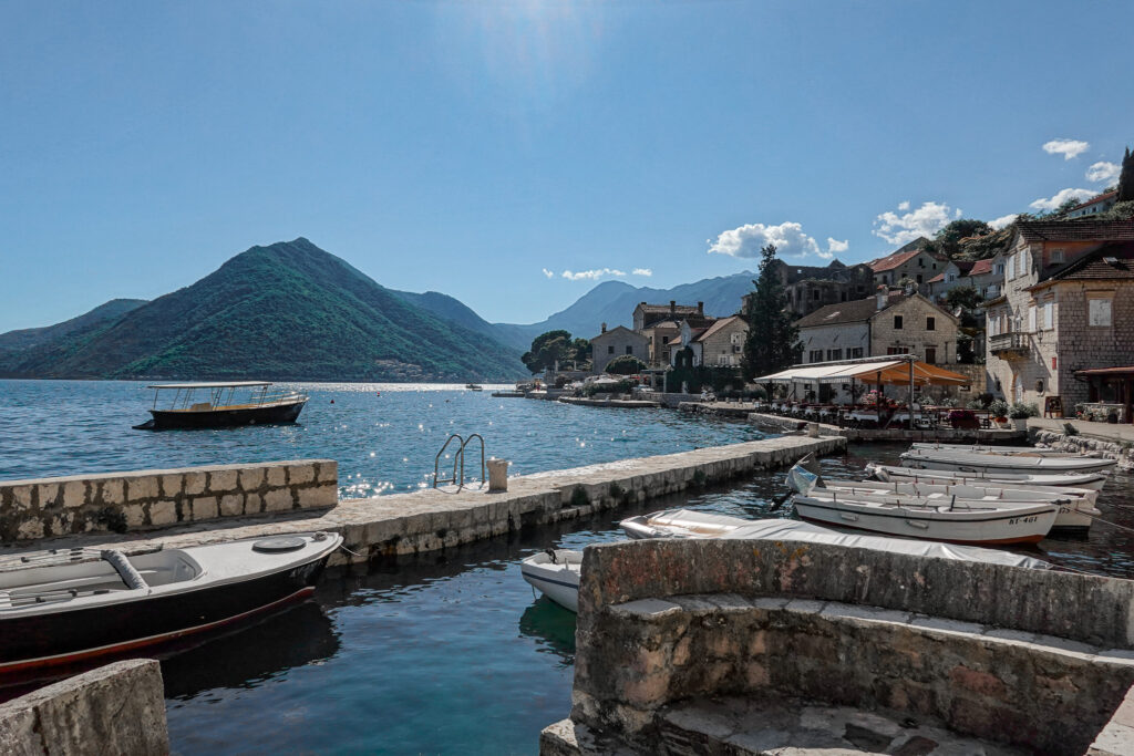 Blue sky and sparkling water along the waterfront promenade in Montenegro
