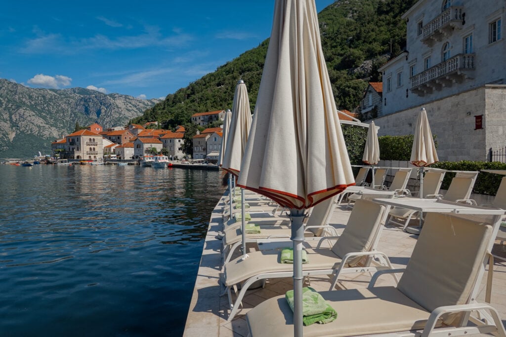 Sun loungers on the Bay of Kotor waterfront in Perast Montenegro
