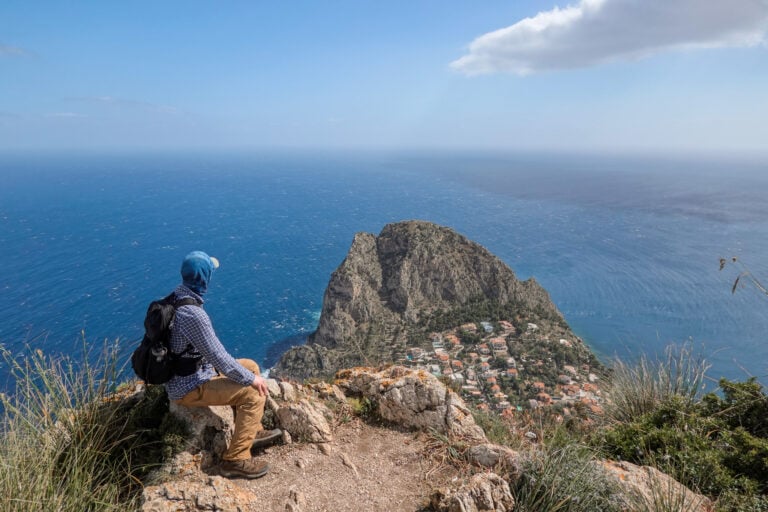 Dan looks down towards a cape called Capo Zafferano