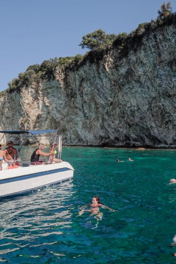 A small boat is stopped in Gremina Bay at Kepi i Qefalit