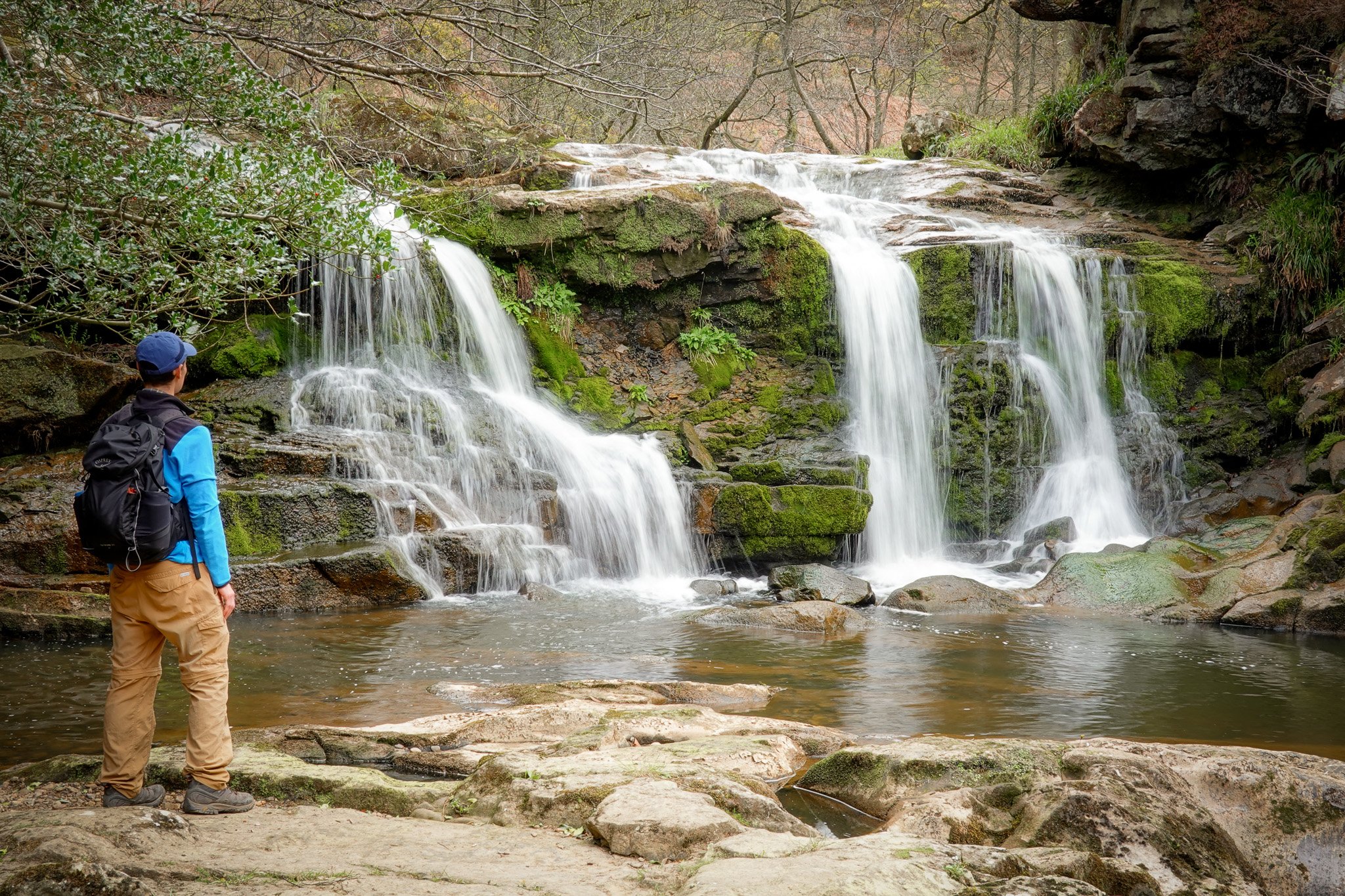 Dan stands and admires a waterfall called Water Arc Foss in the North York Moors