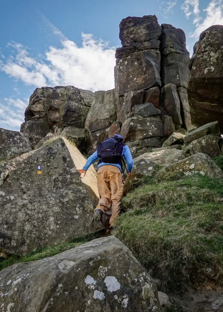 Dan climbs sandstone rocks known as the Wainstones