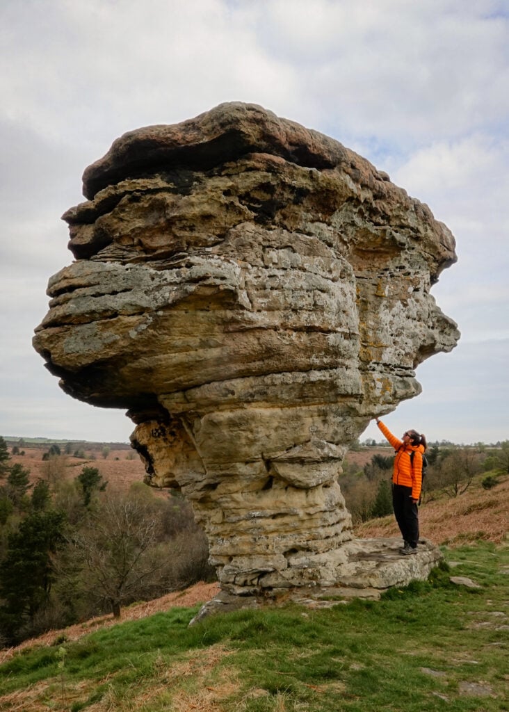 Beck touches a unique shaped rock