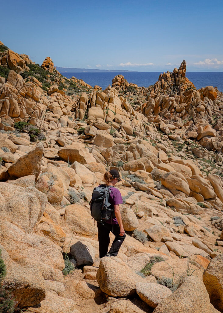 Beck walks among incredibly shaped rocks on Capu di Muru