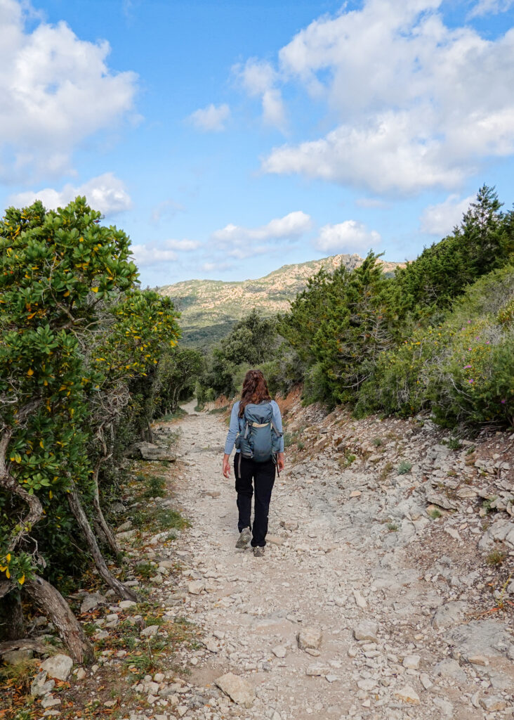 Becks walks on a rocky trail called Strada Vecia in Corsica
