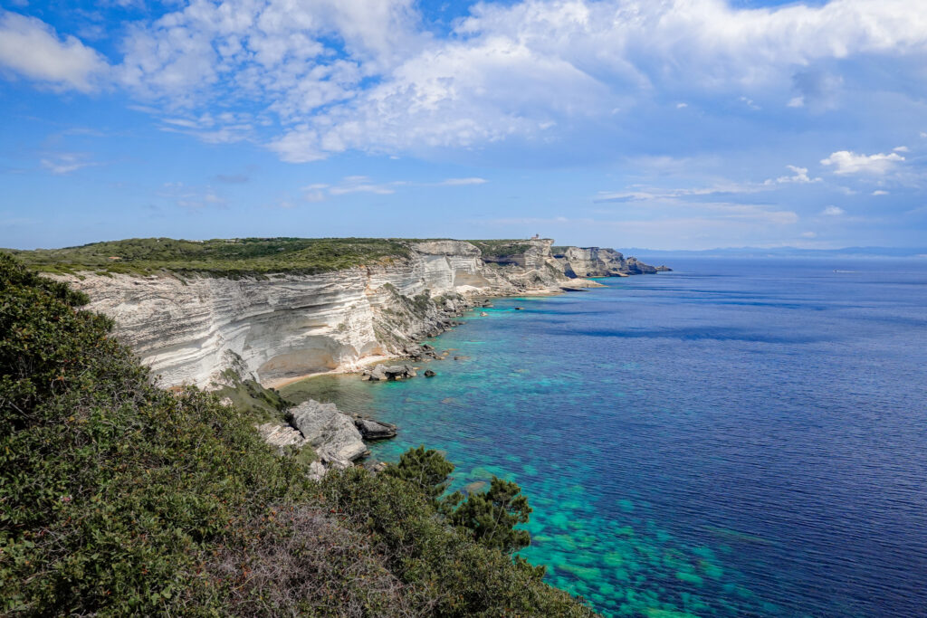 Views of rugged white sea cliffs and pristine turquoise seas from a trail called Campu Rumanilu, which is also known as the Bonifacio Cliff Walk