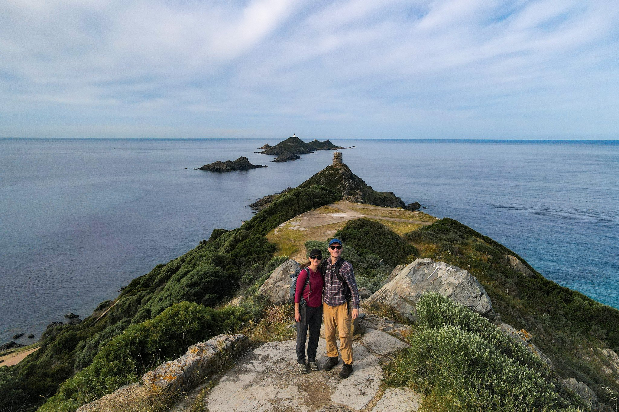 Dan and Beck stand on a headland called Pointe de le Parata during an extended version of a walk called Sentier des Douaniers Ajaccio