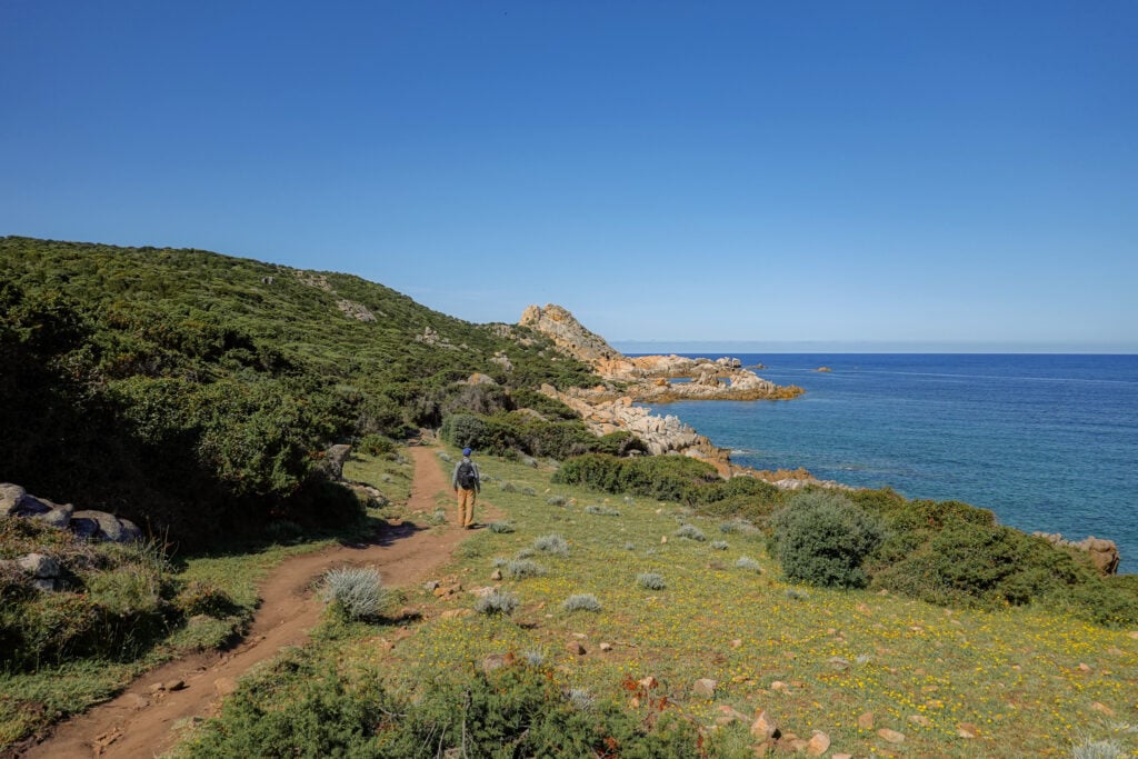 Dan walks on a dirt trail in Corsica called Sentier du littoral de Campomoro