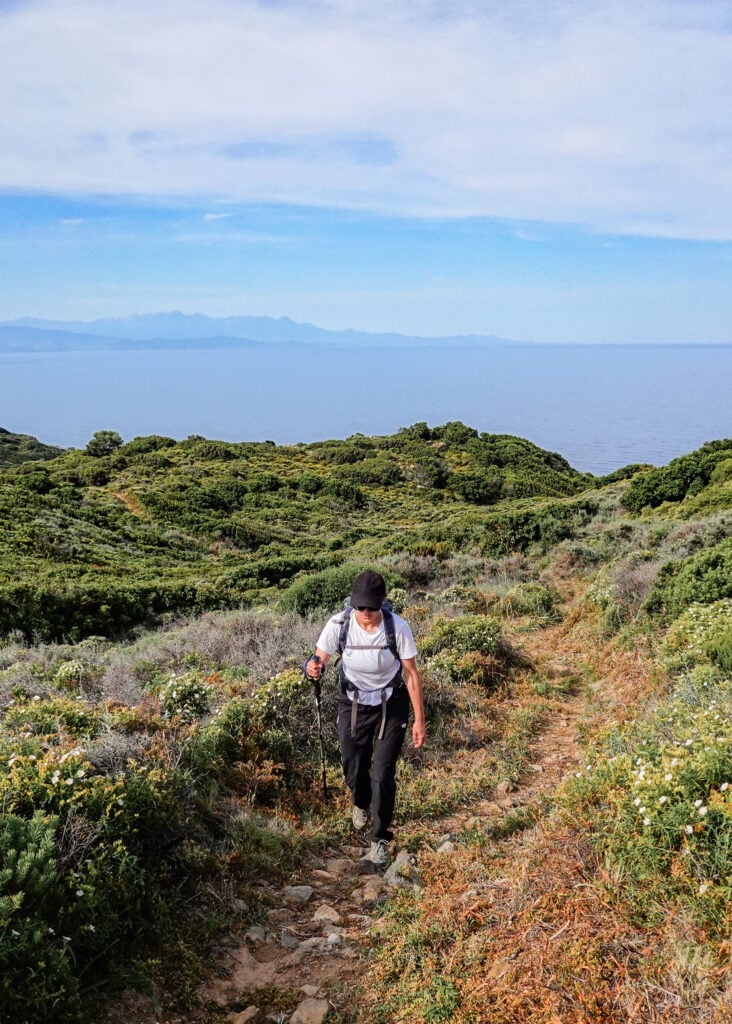 Beck walks up a trail called Sentier des Douaniers Cap Corse