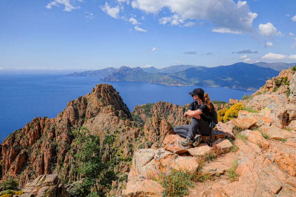 Beck looks towards the coast on Sentier Muletier during the Calanques de Piana Hike