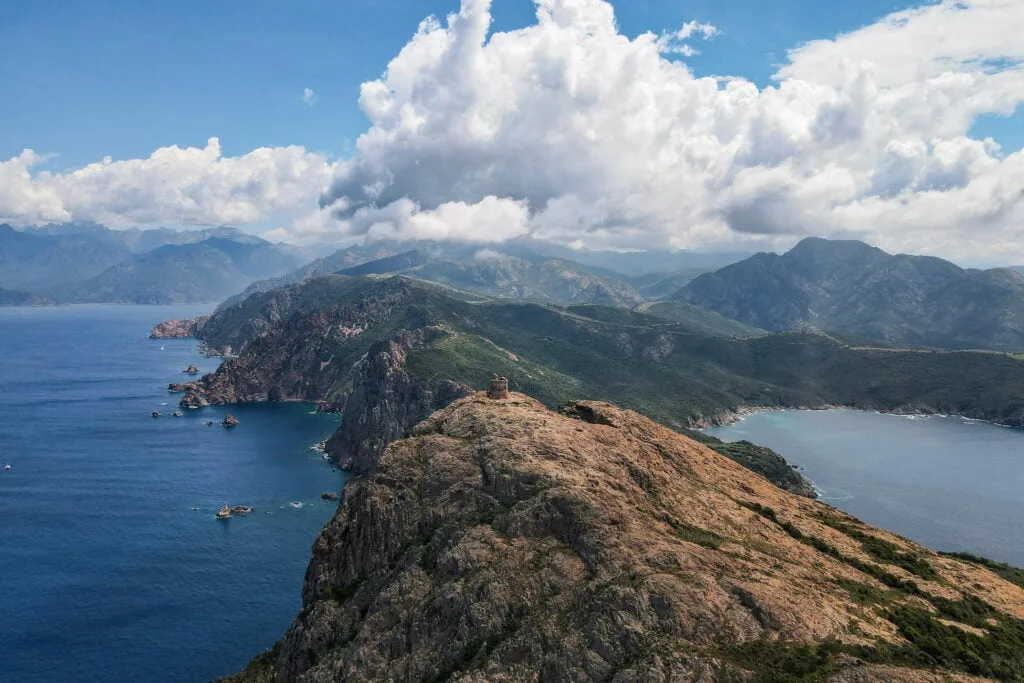 An aerial photograph of Capo Rosso and the surrounding mountains
