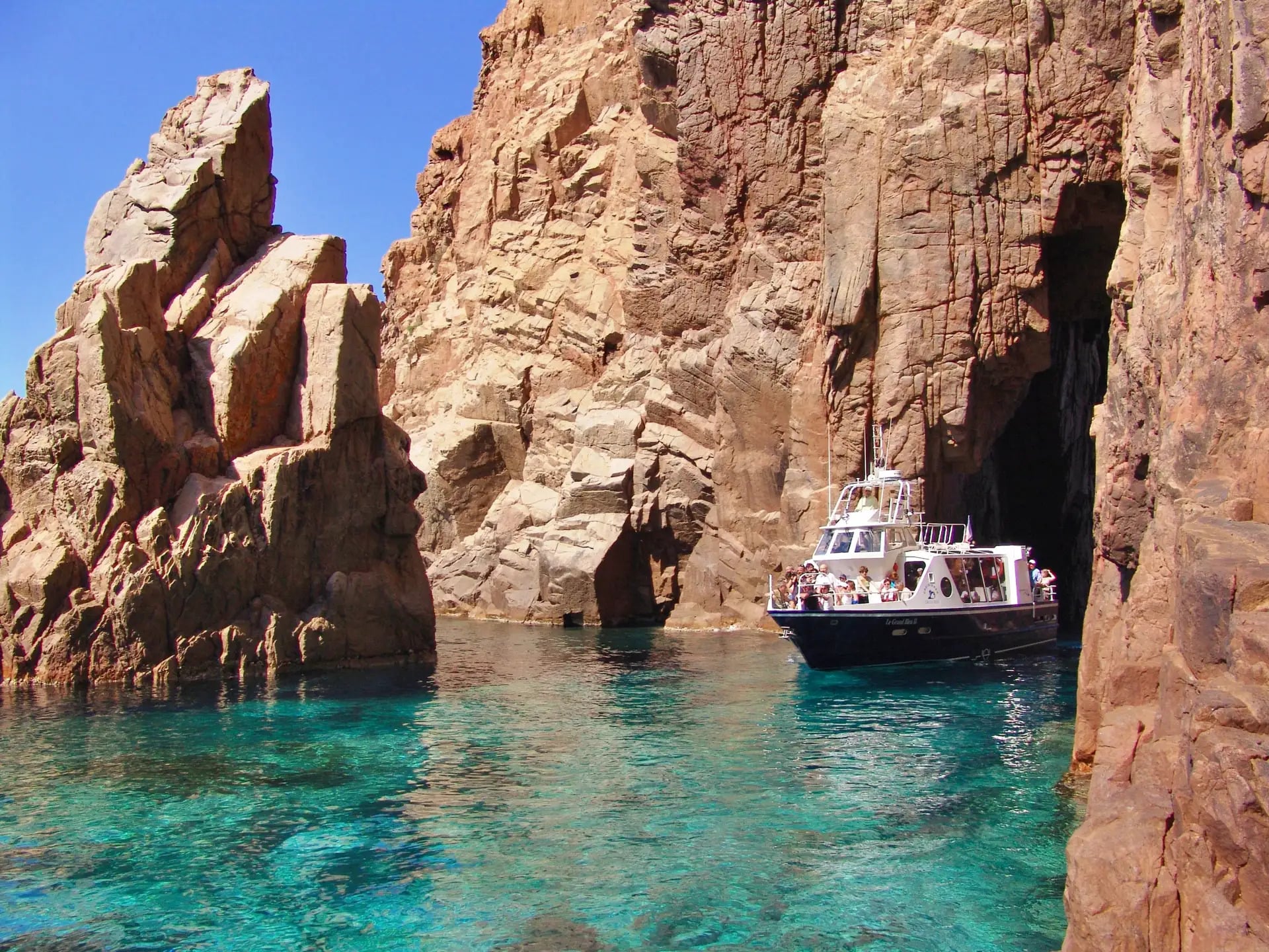 A boat near sea cliffs