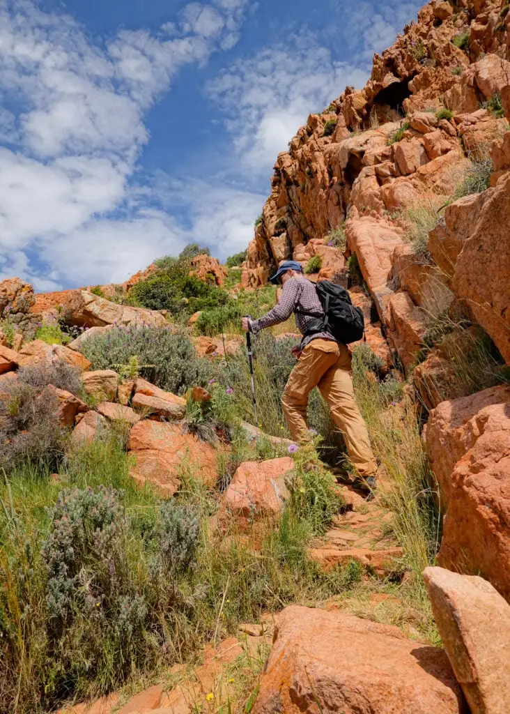 Dan ascends a steep section of the Capo Rosso Hiking Trail