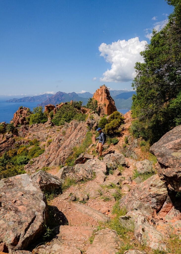 Dan navigating a switchback trail on Sentier Muletier during the Calanques de Piana Hike