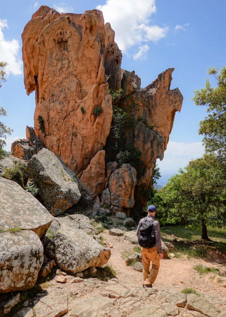 Dan walks by a uniquely chaped rock during Sentier du Château Fort Piana
