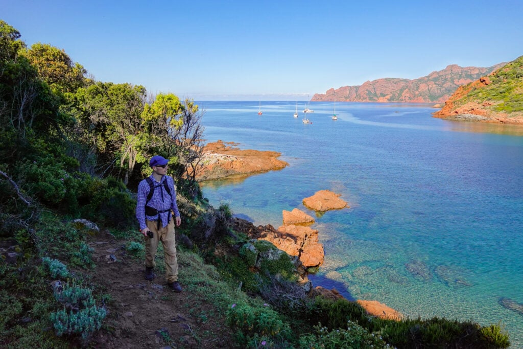 Dan walks on a coastal trail called Sentier du Facteur Girolata