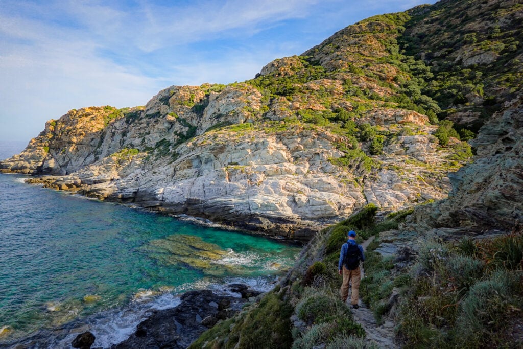 Dan walks down a shaded coastal trail called Sentier des Douaniers Cap Corse