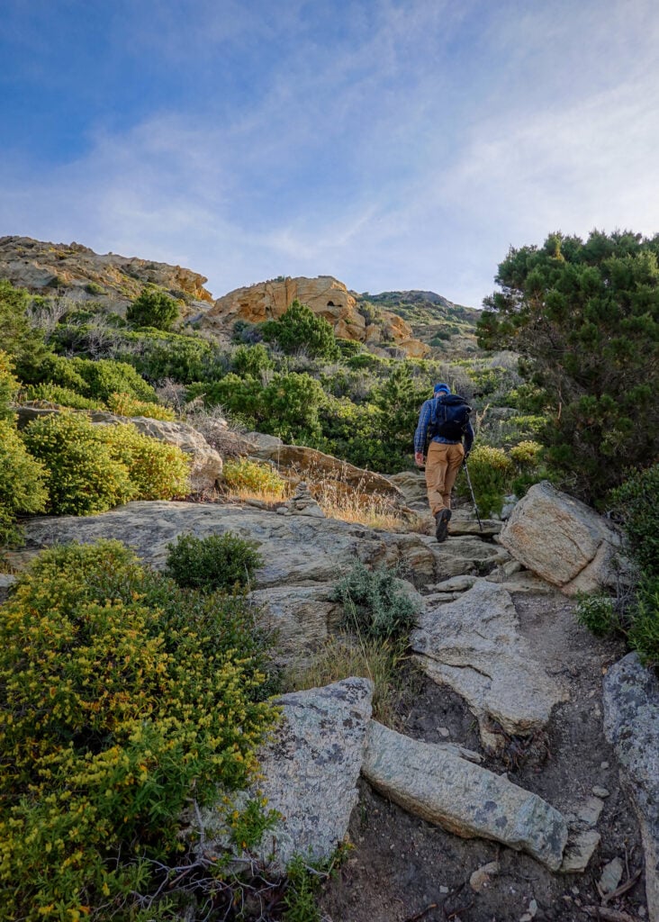 Dan walks up a steep section of a coastal walk called Sentier des Douaniers Cap Corse