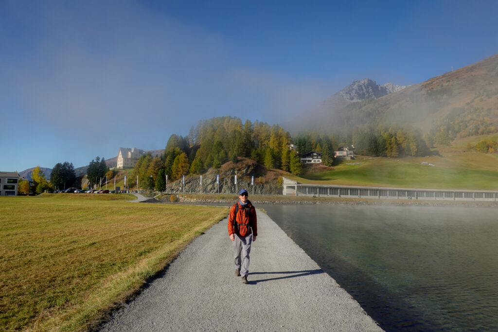 Dan walks along a track by a lake called Davosersee Rundweg
