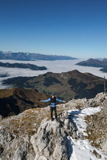 Dan stands atop of a mountain called Ratschenhorn during a hike from Madrisa