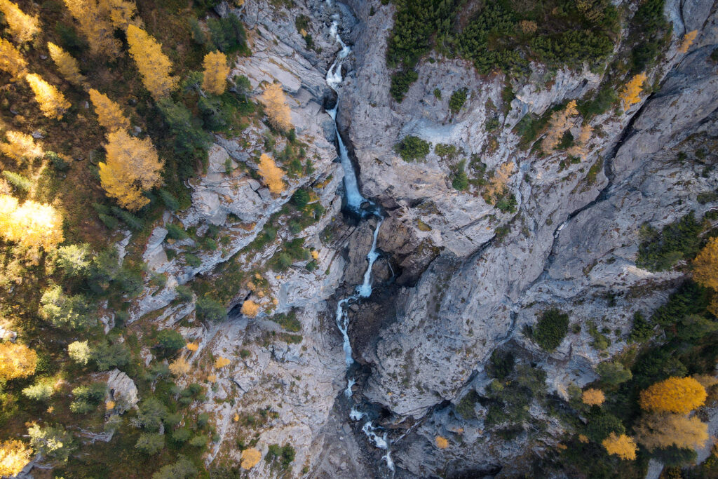 An aerial view of a waterfall called Sertig Waterfall