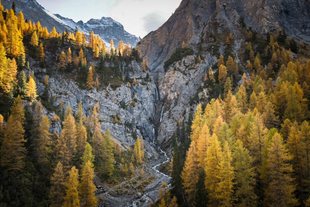 An aerial view of multi-tier waterfall called Sertig Waterfall