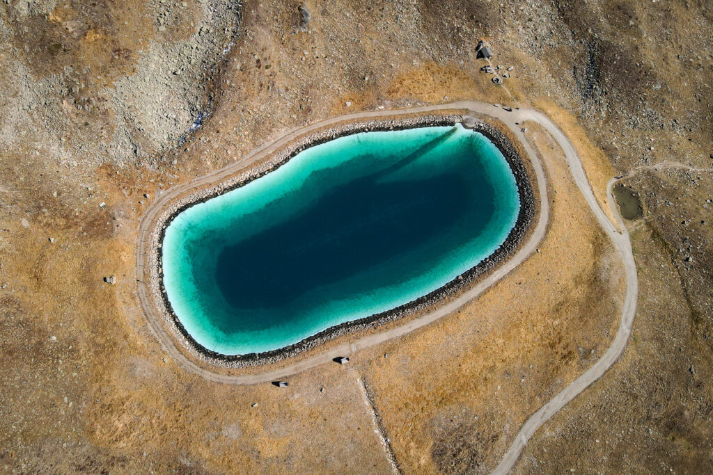 A drone shot of a small lake taken during the Jakobshorn Hike to Sertig
